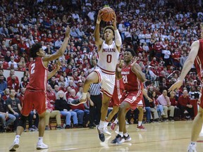 Indiana guard Romeo Langford (0) shoots in front of Wisconsin guard Khalil Iverson (21) during the second half of an NCAA college basketball game in Bloomington, Ind., Tuesday, Feb. 26, 2019. Indiana won 75-73 in double overtime.