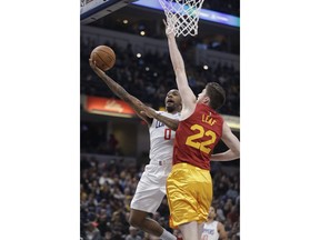 Los Angeles Clippers' Sindarius Thornwell (0) shoots against Indiana Pacers' T.J. Leaf (22) during the first half of an NBA basketball game Thursday, Feb. 7, 2019, in Indianapolis.