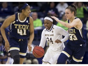 Notre Dame's Arike Ogunbowale (24) drives downcourt between Georgia Tech's Kierra Fletcher (41) and Francesca Pan (33) during the first half of an NCAA college basketball game Sunday, Feb. 3, 2019, in South Bend, Ind.