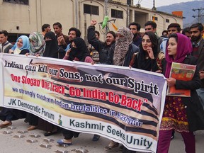 Kashmiri students rally against the Indian government in Muzaffarabad, capital of Pakistani Kashmir, Wednesday, Feb. 20, 2019. India has halted a key bus service with the Pakistani-controlled part of Kashmir, severing the only land route linking the divided Himalayan region. Pakistani official Shahid Mehmood said on Wednesday that New Delhi suspended the bus service this week without explanation.