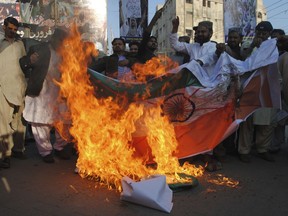 Pakistani protesters burn a representation of an Indian flag during a rally ahead of Kashmir Day in Hyderabad, Pakistan, Monday, Feb. 4, 2019. Pakistan will observe Kashmir Day on Feb. 5 in solidarity with Indian Kashmiris struggling for their independence.