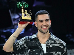 Italian singer Mahmood celebrates on stage after winning the 69th Sanremo Italian Song Festival at the Ariston theater in Sanremo, Italy, on Saturday, Feb. 9, 2019.