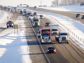 The "United We Roll" convoy of semi-trucks travels the highway near Red Deer, Alta., Thursday, Feb. 14, 2019, on its way to Ottawa to draw attention to lack of support for the energy sector and lack of pipelines. Hundreds of trucks are expected to roll into Ottawa Tuesday to protest the federal government's policies on the oil industry.THE CANADIAN PRESS/Jeff McIntosh