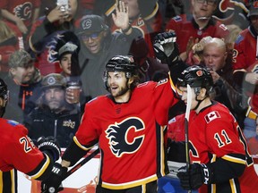 Calgary Flames' Michael Frolik, left, of the Czech Republic, celebrates his goal with teammmate Mikael Backlund, of Sweden, during third period NHL hockey action against the Arizona Coyotes in Calgary, Monday, Feb. 18, 2019.THE CANADIAN PRESS/Jeff McIntosh