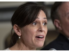 Quebec Junior Education Minister and newly nominated as responsible for the Status of Women portfolio Isabelle Charest responds to reporters at a news conference, Tuesday, February 5, 2019 at the legislature in Quebec City.