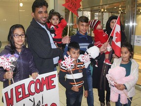 Members of the Barho family are shown upon arrival in Canada on Sept. 29 2017, at the Halifax airport in a handout photo.