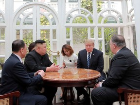 ALTERNATE CROP OF KNS802 - In this Thursday, Feb. 28, 2019, photo provided Friday, March 1, 2019, by the North Korean government, U.S. President Donald Trump, second from right, and North Korean leader Kim Jong Un, second from left, talk at a hotel in Hanoi, Vietnam. U.S. Sec. of State Mike Pompeo is at right. Kim Yong Chol, a North Korean senior ruling party official and former intelligence chief is at left. The content of this image is as provided and cannot be independently verified. (Korean Central News Agency/Korea News Service via AP)