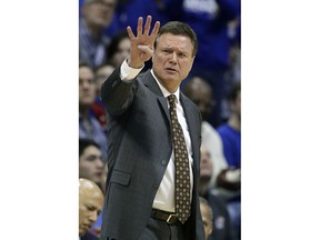 Kansas head coach Bill Self motions to his players during the first half of an NCAA college basketball game against Oklahoma State Saturday, Feb. 9, 2019, in Lawrence, Kan.