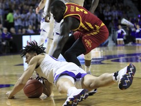 Kansas State guard Mike McGuirl (00) steals the ball from Iowa State guard Marial Shayok (3) during the first half of an NCAA college basketball game in Manhattan, Kan., Saturday, Feb. 16, 2019.