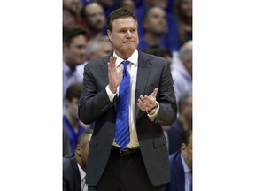 Kansas head coach Bill Self applauds his team during the second half of an NCAA college basketball game against Kansas State in Lawrence, Kan., Monday, Feb. 25, 2019.