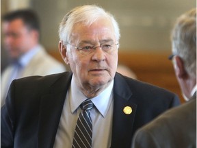 State Rep. Ron Highland, R-Wamego, speaks with colleagues, Friday, Feb. 22, 2019, in Topeka, Kan. The A conservative Kansas legislator has apologized and said he has asked that he be removed as a sponsor of a bill calling same-sex marriages a "parody."  Highland took the actions Thursday, Feb. 21, after his LGBTQ daughter posted a letter to him on Facebook that ended with, "Shame on you."