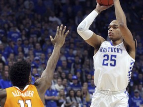 Kentucky's PJ Washington (25) shoots while defended by Tennessee's Kyle Alexander (11) during the first half of an NCAA college basketball game in Lexington, Ky., Saturday, Feb. 16, 2019.