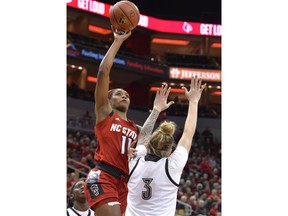 North Carolina State guard Kiara Leslie (11) shoots over Louisville forward Sam Fuehring (3) during the first half of an NCAA college basketball game in Louisville, Ky., Thursday, Feb. 28, 2019.