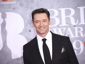 Actor Hugh Jackman poses for photographers upon arrival at the Brit Awards in London, Wednesday, Feb. 20, 2019.