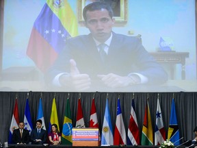 Venezuelan Opposition Leader Juan Guaido makes brief remarks via video link at the opening session of the of the Lima Group in Ottawa on Monday, Feb. 4, 2019.