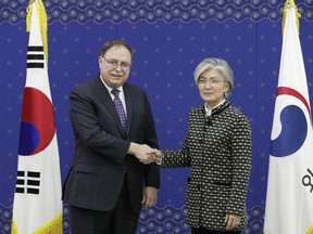 South Korean Foreign Minister Kang Kyung-wha, right, and Timothy Betts, acting Deputy Assistant Secretary and Senior Advisor for Security Negotiations and Agreements in the U.S. Department of State, shake hands for the media before their meeting at Foreign Ministry in Seoul, South Korea, Sunday, Feb. 10, 2019.