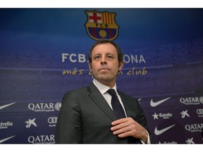 FILE - In this Thursday, Jan 23, 2014 file photo, FC Barcelona's president Sandro Rosell attends a press conference at the Camp Nou stadium in Barcelona, Spain. The trial of the former Barcelona president charged with money laundering involving the sale of television rights for Brazil matches begins on Monday Feb. 25, 2019.