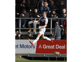 Burnley's Chris Wood celebrates scoring his side's first goal of the game against Tottenham Hotspur during their English Premier League soccer match at Turf Moor in  Burnley, England, Saturday Feb. 23, 2019.