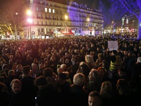 People gather at the Republique square to protest against anti-Semitism, in Paris, France, Tuesday, Feb. 19, 2019. In Paris and dozens of other French cities, ordinary citizens and officials across the political spectrum geared up Tuesday to march and rally against anti-Semitism, following a series of anti-Semitic acts that shocked the nation.