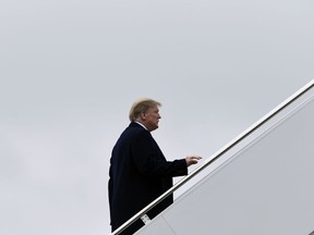 President Donald Trump walks up the steps of Air Force One at Andrews Air Force Base in Md., Monday, Feb. 11, 2019. Trump is heading to El Paso, Texas, to try and turn the debate over a wall at the U.S.-Mexico border back to his political advantage as his signature pledge to American voters threatens to become a model of unfulfilled promises.