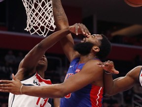 Washington Wizards center Thomas Bryant (13) fouls Detroit Pistons center Andre Drummond (0) during the first half of an NBA basketball game, Monday, Feb. 11, 2019, in Detroit.