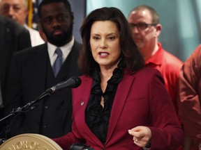 In this Tuesday, Feb. 26, 2019 photo, Michigan Gov. Gretchen Whitmer talks about the proposed new Chrysler auto plant in Detroit. Whitmer said Wednesday, Feb. 27, that Michigan's incentives for Fiat Chrysler to add 6,500 jobs in the state will not require legislative approval. She said the state will use existing economic development programs to assist the automaker's planned $4.5 billion expansion, which was announced Tuesday.