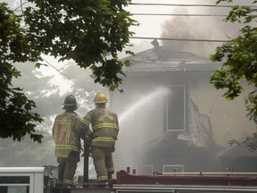 In an Aug. 10, 2017 photo, emergency personnel respond to a 4-alarm house fire in the 1800 block of Pringle Avenue in Jackson, Mich. Michigan police say a transgender, gay rights activist tried to fabricate a hate crime by setting his home on fire, but the man's attorney is questioning the evidence. Attorney Daniel Barnett said the evidence is circumstantial and doesn't provide proof beyond a reasonable doubt that Nikki Joly set the August 2017 fire that killed five pets at his home.