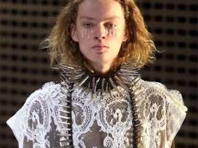 A model presents a creation by Gucci during the Milan Fashion Week, in Milan, Italy, Wednesday, Feb. 20, 2019.