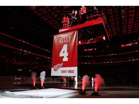 Former Detroit Red Wings player Red Kelly, displayed on the video board, watches during his jersey retirement ceremony before an NHL hockey game against the Toronto Maple Leafs, Friday, Feb. 1, 2019, in Detroit.