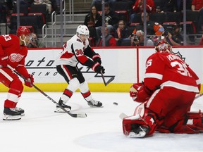 Ottawa Senators center Colin White (36) shoots on Detroit Red Wings goaltender Jimmy Howard (35) as Trevor Daley (83) defends in the first period of an NHL hockey game Thursday, Feb. 14, 2019, in Detroit.