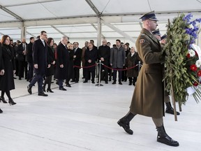 United States Vice President Mike Pence with his wife Karen, Prime Minister of Poland Mateusz Morawiecki with his wife Iwona and Israeli Prime Minister Benjamin Netanyahu with his wife Sara, from left, walk to a wreath laying ceremony at the Monument to the Ghetto Heroes in Warsaw, Poland, Thursday, Feb. 14, 2019. The Polish capital is host for a two-day international conference on the Middle East, co-organized by Poland and the United States.