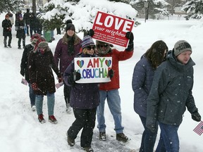 Snow falls as rally goers arrive at Boom Island Park for Democratic Sen. Amy Klobuchar's announcement of her decision in the race for president at a rally Sunday, Feb. 10, 2019, at Boom Island Park in Minneapolis.