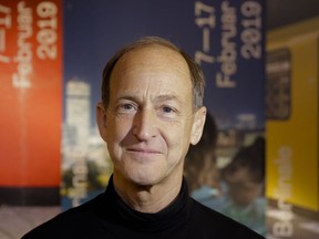 Director Charles Ferguson poses for a photo prior to an interview with the Associated Press about his movie 'Watergate" at the 2019 Berlinale Film Festival in Berlin, Germany, Tuesday, Feb. 12, 2019.