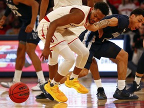 St. John's guard Shamorie Ponds and Villanova guard Jahvon Quinerly (1) battle for the ball during the first half of an NCAA college basketball game Sunday, Feb. 17, 2019, in New York.