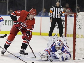 New York Rangers goaltender Henrik Lundqvist (30) stops a shot by Carolina Hurricanes' Andrei Svechnikov (37) during the first period of an NHL hockey game Friday, Feb. 8, 2019, in New York.