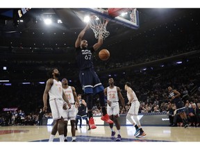 Minnesota Timberwolves' Taj Gibson (67) dunks the ball in front of New York Knicks' DeAndre Jordan (6), Damyean Dotson (21) and Noah Vonleh (32) during the first half of an NBA basketball game Friday, Feb. 22, 2019, in New York.