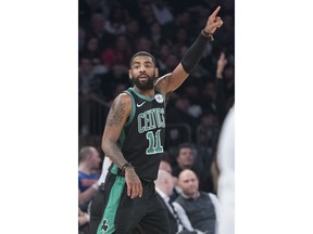Boston Celtics guard Kyrie Irving reacts after scoring a goal during the second half of an NBA basketball game against the New York Knicks, Friday, Feb. 1, 2019, at Madison Square Garden in New York. The Celtics won 113-99.