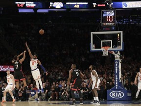 Toronto Raptors' Kyle Lowry (7) shoots over New York Knicks' Kadeem Allen (0) during the second half of an NBA basketball game Saturday, Feb. 9, 2019, in New York. The Raptors won 104-99.