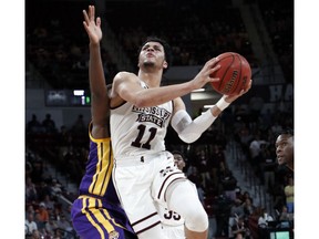 Mississippi State guard Quinndary Weatherspoon (11) drives to the basket for a layup attempt past a LSU defender during the first half of an NCAA college basketball game in Starkville, Miss., Wednesday, Feb. 6, 2019.