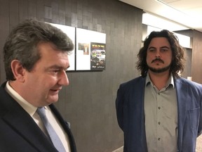 Lawyer Marc Michaud (left) and Matthieu Brien speak to reporters in Montreal, Thursday, Feb.7, 2019, after the Crown withdrew charge of obstruction against him involving Prime Minister Justin Trudeau.