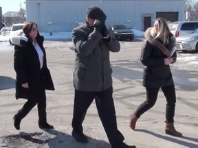 In this image from video, police take Mario Monette into custody in Longueuil, Que. Police have arrested a pastor from suburban Montreal and his wife on charges that over a 45-year period they used corporal punishment on children and encouraged their followers to do the same. THE CANADIAN PRESS/HO- Longueuil Police MANDATORY CREDIT