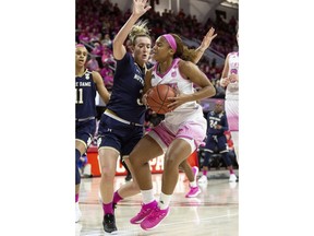 North Carolina State's Kai Crutchfield, right, handles the ball as Notre Dame's Marina Mabrey, left, defends during the first half of an NCAA college basketball game in Raleigh, N.C., Monday, Feb. 18, 2019.
