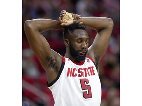North Carolina State's Eric Lockett (5) rests his hands above his head during the final minutes of an NCAA college basketball game against Virginia Tech in Raleigh, N.C., Saturday, Feb. 2, 2019.