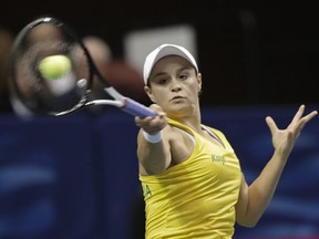 Australia's Ashleigh Barty returns a shot against United State's Sofia Kenin in their first-round Fed Cup tennis match in Asheville, N.C., Saturday, Feb. 9, 2019.