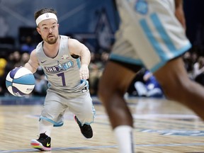 Away team's Brad Williams (7) dribbles during the first half of an NBA All-Star Celebrity basketball game in Charlotte, N.C., Friday, Feb. 15, 2019.