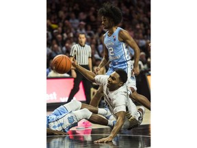 Wake Forest's Brandon Childress (0) falls in the lane during the first half of an NCAA college basketball against North Carolina in Winston-Salem, N.C., on Saturday, Feb 16, 2019.