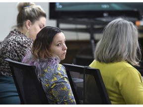 Katrina Silk, middle, sits in a Morton County Courtroom on Tuesday, Feb. 5, 2019 during her bench trial on charges related to her arrest while protesting the construction of the Dakota Access Pipeline south of Mandan, N.D.  Silk was convicted Tuesday of obstructing a government function. But, Judge David Reich acquitted Silk on four other misdemeanor charges stemming from her arrest in a field along the pipeline route in October 2016.