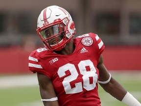 In this Sept. 8, 2018 photo, Nebraska running back Maurice Washington warms up before an NCAA college football game against Colorado, in Lincoln, Neb. California authorities have filed criminal charges against Nebraska's Washington. He is suspected of possessing a video of his underage high school girlfriend being sexually assaulted by two other people and sending that video to the girl less than a year ago. The university athletic department said it was aware of the situation and Washington's attorney said his client would cooperate with authorities.