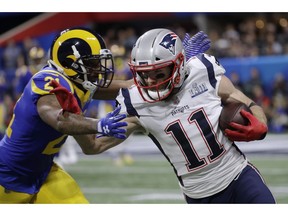 Los Angeles Rams' Aqib Talib, left, chases New England Patriots' Julian Edelman during the first half of the NFL Super Bowl 53 football game Sunday, Feb. 3, 2019, in Atlanta.
