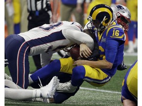 New England Patriots' Kyle Van Noy (53) sacks Los Angeles Rams' Jared Goff (16) during the second half of the NFL Super Bowl 53 football game Sunday, Feb. 3, 2019, in Atlanta.